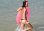Topless hottie exposed walking in the water withe her pink balloon