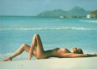 Nudist beauty laying naked on the warm sands