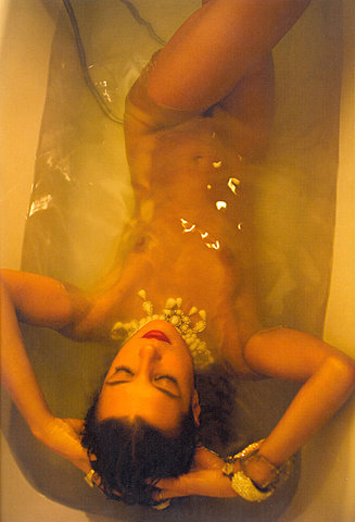 Sweet naked babe bathing
